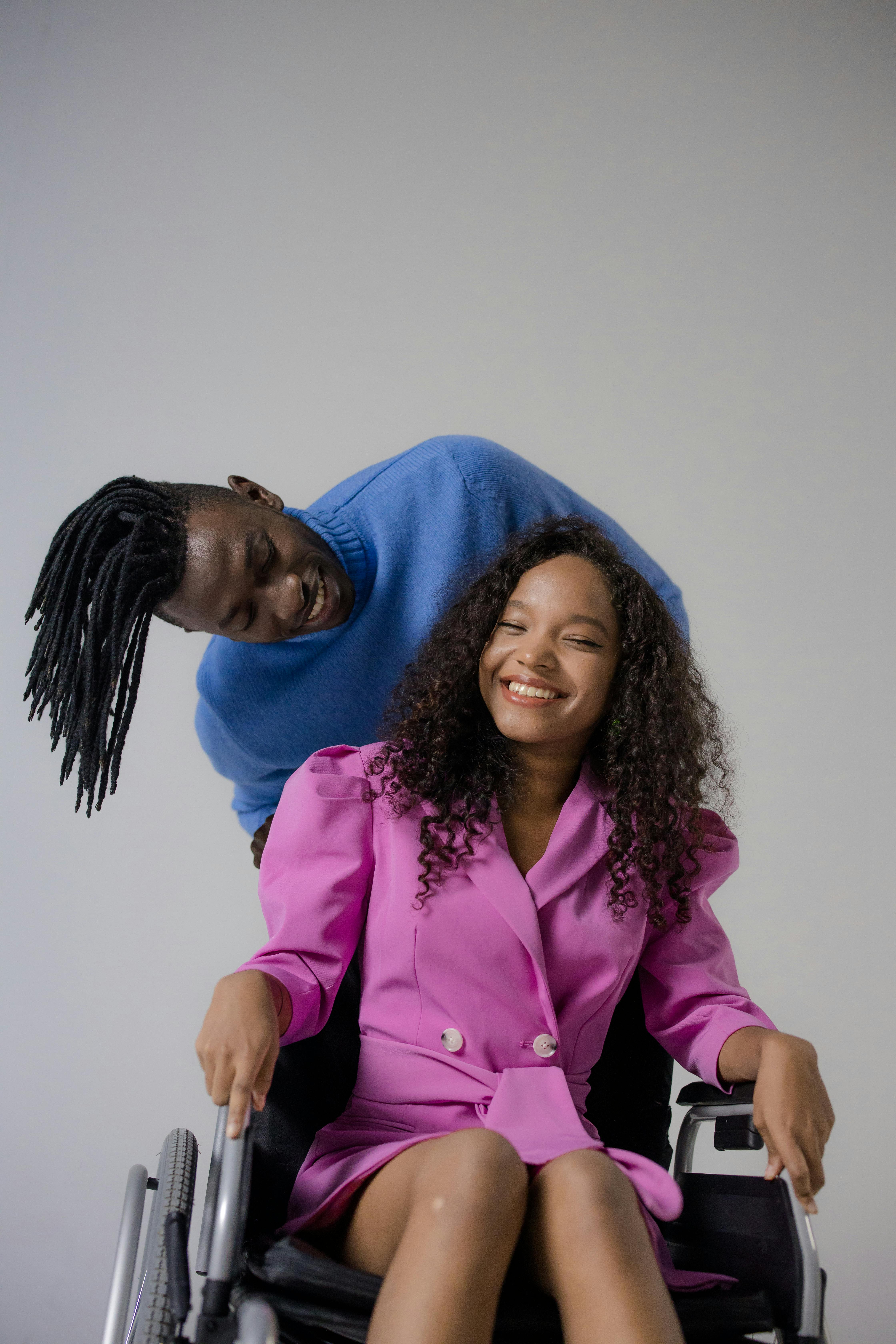 Support worker and participant smiling together